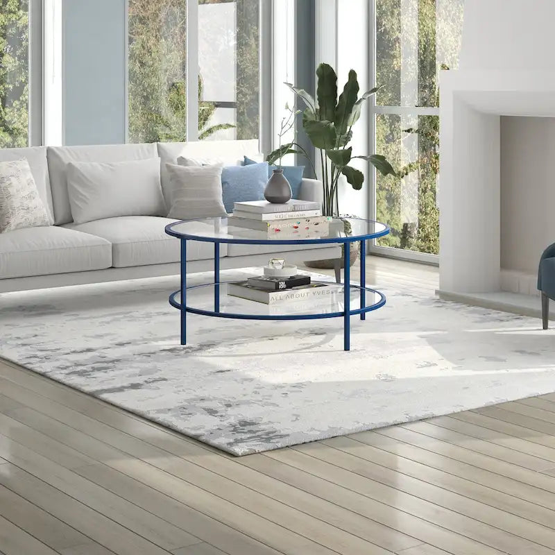 Table basse ronde avec plateau en verre et étagère inférieure – Laiton / Blanc / Nickel / Bleu Mykonos – 91 cm